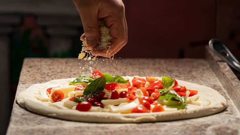 Close-up of via 313 pizza slice with crispy edges